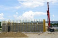 The facade of a building built of building blocks with wooden laths for attaching decorative panels