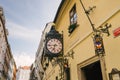 Facade of the building and clock of the famous and ancient U Fleku brewery Royalty Free Stock Photo