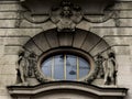 The facade of the building is decorated with an oval window in the Art Nouveau style Royalty Free Stock Photo