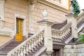 The facade of the building with a granite staircase and stone railings with balustrades. Royalty Free Stock Photo