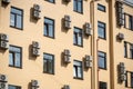 Facade of building with many air conditioners on windows in southern hot country. Royalty Free Stock Photo