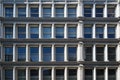 Facade of building in new york with symmetrical windows.