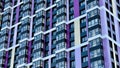 The facade of the building in purple,geometric patterns from windows and balconies, the colored wall of a modern multi Royalty Free Stock Photo