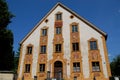 Facade of building with thirteen windows and a door in Oberammergau in Germany