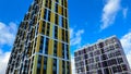 Facade of the building in yellow and orange colors, geometric patterns from windows and balconies, colored wall of a Royalty Free Stock Photo