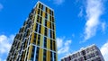 Facade of the building in yellow and orange colors, geometric patterns from windows and balconies, colored wall of a Royalty Free Stock Photo