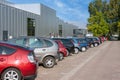 Facade business establishment with row of parked cars