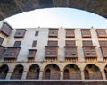 Facade of caravansary of Bazaraa framed by stone arch, with vaulted arcades and wooden oriel windows, Cairo, Egypt