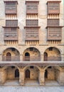 Facade of caravansary of Bazaraa, with vaulted arcades and windows covered by interleaved wooden grids mashrabiyya, Cairo, Egypt