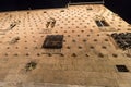 Facade of Casa de las Conchas in Salamanca at night, Spain, covered in scalloped shells, Community of Castile and LeÃÂ³n, Spain.