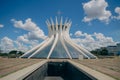Facade of The Cathedral of Brasilia against a blue cloudy sky in Brasilia, Brazil