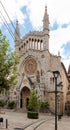 Facade of the church of San BartolomÃÂ© in Soller, in Majorca with the tracks of its famous tram in front of it