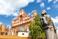 Facade of the Church of St. Francis of Assisi and the Monument to Adam Mickiewicz in Vilnius, Lithuania