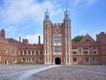 The facade and clocktower of the main building on the campus of Eton College,