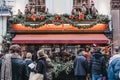 Facade of Clos Maggiore French restaurant in Covent Garden, London, decorated for Christmas, people in front