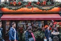 Facade of Clos Maggiore French restaurant in Covent Garden, London, decorated for Christmas, people in front