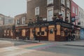 Facade of the closed The Elephant Head pub and shops in Camden Town, London, UK