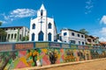 Colonial catholic church and graffitti mural in brazilian northeastern little town