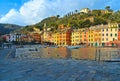 15.03.2018. facade of colorful old buildings and architecture with people walking on dock in small coastal village Portofino in Li