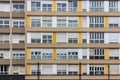 Facade of constructivist house with windows in the style of seventies with yellow panels