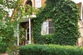 Facade of counrty house with green ivy Royalty Free Stock Photo