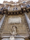 Facade of a decorated building with statues to Palermo in Sicily, Italy.