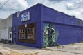 The facade of the Delta Blues Alley Cafe, with a mural of a blues guitarrist, in Clarksdale, Mississippi