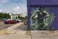 The facade of the Delta Blues Alley Cafe, with a mural of a blues guitarrist, in Clarksdale, Mississippi