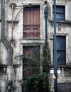 Facade of a derelict collapsing abandoned commercial property