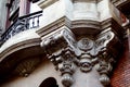 Facade detail and close-up with flourishes and face also with balcony