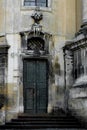 Facade of the Dominican Cathedral, Lviv, Ukraine. Fragment with door and window metal grill. Royalty Free Stock Photo