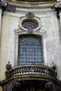 Facade of the Dominican Cathedral, Lviv, Ukraine. Fragment window with metal gril and balcony. Close up. Royalty Free Stock Photo