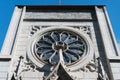 Facade element of the Catholic Church against the blue sky