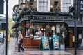 Facade of The Elephants Head pub in Camden, London, UK, man walks by, selective focus