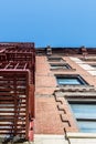 Facade and fire escape of pre-war walkup apartment building