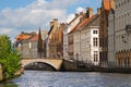 Facade of flemish houses and canal in Brugge