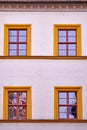 Facade with four orange framed windows Royalty Free Stock Photo