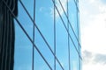 Modern office building facade abstract fragment, shiny windows in steel structure.