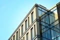 Modern office building facade abstract fragment, shiny windows in steel structure.