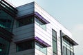 Modern office building facade abstract fragment, shiny windows in steel structure.