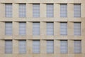 Facade of office building with closed shutter blinds