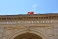 Facade of German main station and `Deutsche Bahn` train comppany logo above