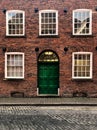 Facade of a grand red brick Victorian townhouse