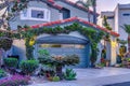 Facade of gray house with bay window gable roof over garage and arched entrance Royalty Free Stock Photo