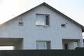 Facade of a gray private concrete house with windows Royalty Free Stock Photo