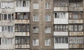 Facade of a grey multi-storey soviet panel building