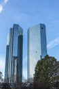 Facade of headquarter of German Bank with mirroring skyscraper in Frankfurt