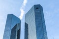 Facade of headquarter of German Bank with mirroring skyscraper in Frankfurt