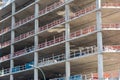 Facade of high-rise concrete building under constraction