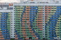 Facade of high-rise multi-storied residential buildings with loggias and windows. Beautiful colorful urban background. Housing